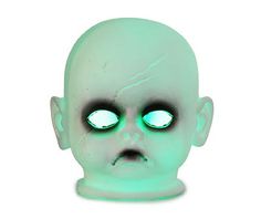 an alien head with glowing green eyes on a white background