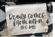 beauty comes from within this bag on a black and white checkered tablecloth with flowers