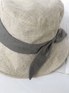 This stylish beige linen hat features a wide brim for excellent sun protection. Made from breathable, high-quality linen, it ensures comfort in warm weather. Available in large sizes up to XL (59-63 cm), it provides a secure fit for larger head sizes. Perfect for gardening, beach trips, and casual outings, this durable Linen Bucket Hat combines functionality with fashionable design.SpecificationsMaterial: 100% cottonSize: S:53-55cmM:56-58cmL:59-63cmBrim: 6.5-10cm Khaki Flat Brim Sun Hat For Summer, Summer Khaki Sun Hat With Flat Brim, Spring Beach Bucket Hat In Khaki, Gray Lightweight Sun Hat For Summer, Gray Brimmed Bucket Hat For Summer, Gray Brimmed Sun Hat For Summer, Lightweight Gray Sun Hat For Summer, Khaki Cotton Sun Hat For The Beach, Summer Linen Hat With Short Brim