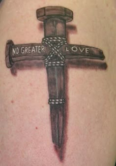 a cross tattoo with the words no greater love on it