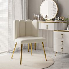 a white chair sitting in front of a mirror on top of a dresser next to a window