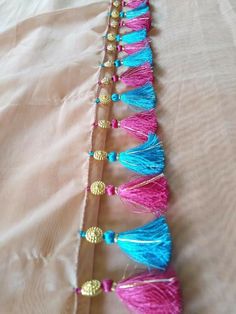 a row of tassels on top of a bed