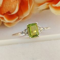 Material :- Silver Primary Stone : - Natural Green Peridot Item Weight :- Approx. 1.85 Grams Approx. Stone treatment :- 100% Natural Stone Size :- 7 MM X 5 MM Stone Shape :- Octagon Cut Secondary Stone : White Topaz ( 6 Stone) Metal :- 925 Solid Sterling Silver Purity :- 925 Select Size in Variation , if you don't find perfect size please buy any size and message us your size we'll make Payment Policy We accept payment through PayPal. All payments must be made within 7 days of purchase. If you a Peridot Engagement Rings, Green Jewelry, Peridot Ring, Green Peridot, Rings Cool, Love Ring, White Topaz, Yellow Gold Rings, Solitaire Ring