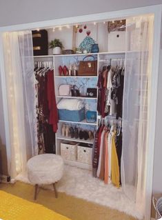 the closet is organized with clothes and other items