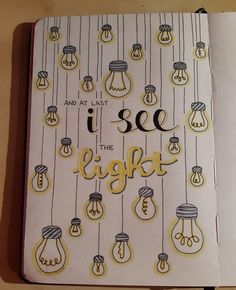 an open notebook with the words i see the light hanging from it's sides