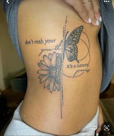 a woman with a butterfly tattoo on her back and the words don't rush your smile