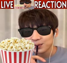 a man in sunglasses eating popcorn and listening to music