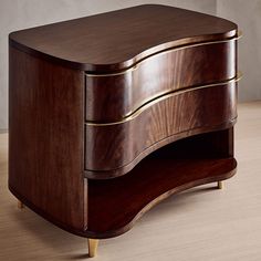 a wooden dresser sitting on top of a hard wood floor