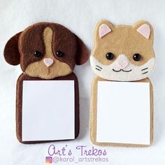 two felt animals with blank paper attached to them