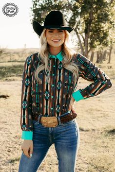 Navigate your way in style with our Red Dirt Road Top! This chic western style shirt has a gray button up, turquoise pearl snaps, and an awesome aztec design with a dash of color from the turquoise collar and cuffs. Lookin' sharp! 95% Polyester 5% spandex SIZE CHEST LENGTH SLEEVE WIDTH SLEEVE LENGTH XS 18.5" 27.5" 5" 24" S 20.5" 28" 5.25" 24.5" M 21" 29" 5.5" 25" L 21.25" 29.5" 5.5" 25.5" XL 23" 30" 6" 25.5" 2X 24" 30.5" 6.5" 25.5" 3X 26.5" 31" 6.5" 26" Western Style Shirt, Red Dirt, Singlet Tops, Aztec Design, Dirt Road, Aztec Designs, Cap Dress, Glitz And Glam, Cardigan Top