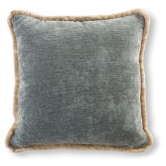 a gray and tan pillow with fringe trim on the bottom, in front of a white background