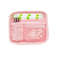 a pink bag with green polka dots on the side and two pens, pencils, and an eraser in it