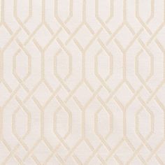 an upholstered white and beige rug with wavy lines on the bottom half of it