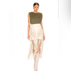 Understated Leather X Revolve Motive Skirt In Cream Size: L Condition: Very Good - Few Fringe Leather Missing Pictured 100% Lamb Leather Lining: 100% Poly Made In Pakistan Professional Leather Clean Only Fully Lined Exposed Back Zipper Closure Metal Eyelet And Leather Fringe Trim Detail Skirt Measures Approx 17.5" In Length Fringe Trim Measures Approx 39" In Length Leather Skirt With Fringe, Chic Midi Skirt With Fringe, Club Mini Skirt With Fringe Details, Luxury Chic Fringe Skirt, Club-wear Fringe Mini Skirt, Suede Fringe Skirt Free People, Leather Cleaning, Leather Fringe, Fringe Trim