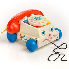 a toy phone sitting on top of a cord