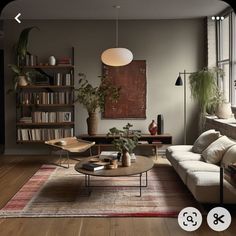 a living room filled with furniture and bookshelves next to a window covered in plants