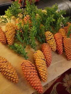 pine cones are arranged on a cutting board