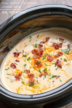 slow cooker cauliflower and bacon soup in a crock pot with text overlay