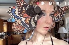 a woman with butterfly wings on her head