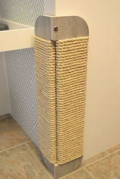 a bathroom with a basket on the floor next to it's toilet paper dispenser