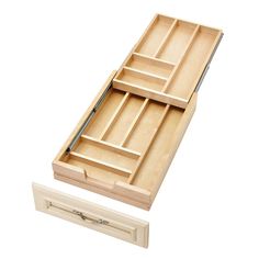 an open drawer with two compartments on the bottom and one in the middle that is closed