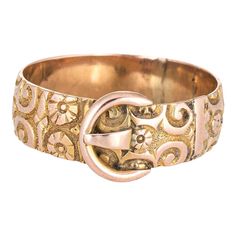 This is part of Chairish’s Costume Jewelry assortment.  Finely detailed antique buckle ring (circa 1913) crafted in 9 karat rose gold.   The stylish antique ring features the ever popular buckle design that symbolises the joining of two lives together. The ring is great worn alone, stacked or as an alternative wedding band. English in origin, the band features several hallmarks (see below). The chased floral pattern is evident around the entire band.  The ring is in good condition. The inner ban Retro Wedding Rings, Edwardian Wedding Ring, Victorian Wedding Band, Gold Flower Pattern, Wedding Rings Sets His And Hers, Antique Rings Victorian, Rose Gold Band Ring, Rose Gold Flower, Edwardian Jewelry