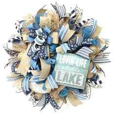 a wreath made out of burlocks and ribbons with the words low life on it