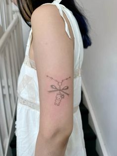 a woman with a tattoo on her arm