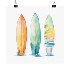 three surfboards sitting next to each other