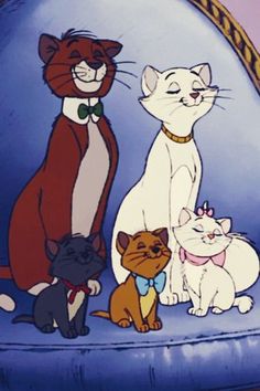 several cartoon cats sitting on top of a blue chair