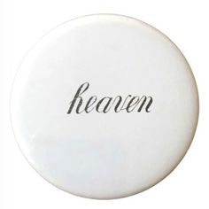 a white frisbee with the word heaven written in cursive writing on it