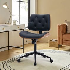 a black office chair sitting on top of a white rug in front of a window