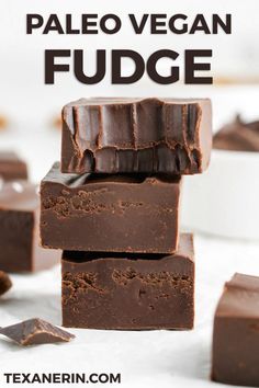 paleo vegan fudge is stacked on top of each other with chocolate in the background