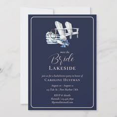 a blue and white wedding card with two adiron chairs on the beach, in front of