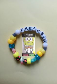 a cell phone bracelet with the words freakbob on it