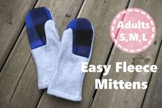 two mittens sitting on top of a wooden floor with the words easy fleece mittens