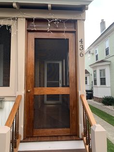 the front door to a house with wooden steps