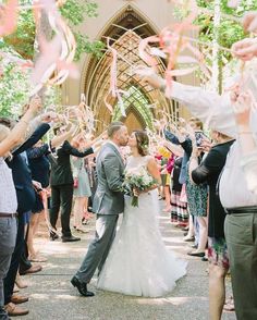 a bride and groom are surrounded by confetti