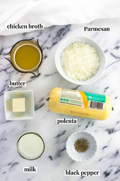 ingredients to make cheesecake sitting on a marble counter top