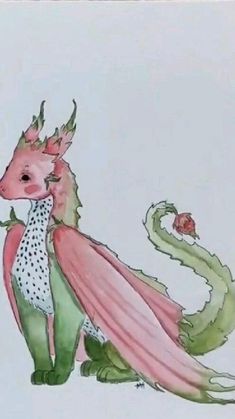 a card with a drawing of a pink and green dragon on it's back