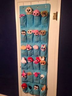 an over the door toy organizer with stuffed animals and doughnuts hanging on it