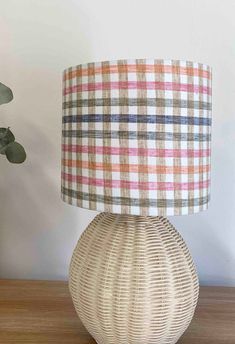 a table lamp with a plaid shade on it