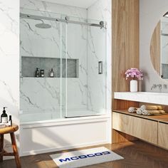 a bathroom with marbled walls and wooden floors