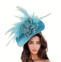 Hats By Cressida Kentucky Derby & Ascot Fascinator Hats Turquoise Blue Jeanine Flower Feather Fascinator  Gorgeous array of feathers surround a large turquoise magnolia flower set on a round soft base.  Base measures 14 inches wide Mounted with a matching headband. If you prefer a headband to match your hair, please make a note at check out what colour headband you want. Jeanine is the perfect fascinator for any formal occasion! Perfect for both Royal Ascot and Kentucky Derby races, this hat is crafted with a round soft base, adorned with a large magnolia flower and an array of feathers, making it an elegant and modern design hatinator. Whether you're the mother of the bride, wedding guest or attending a ladies day, this headpiece is sure to compliment your outfit perfectly!   This Fascina Blue Adjustable Fascinator For Summer, Adjustable Blue Fascinator For Summer, Blue Fitted Fascinator For Beach, Blue Summer Fascinator Hat, Adjustable Light Blue Fascinator For Spring, Adjustable Light Blue Mini Hat For Kentucky Derby, Light Blue Adjustable Mini Hats For Kentucky Derby, Blue Adjustable Fascinator For Garden Party, Spring Blue Fascinator For Garden Party