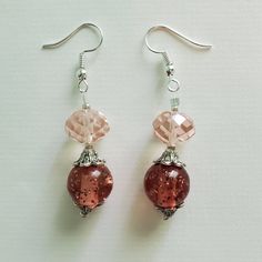 "\"PRISTINE PINK\" earrings These pretty pink earrings are made up of pale pink faceted glass beads, vintage round pink acrylic beads, silver etched metal beads, and silver seed beads. Approximate Measurements: Earring Length - 2.25 inches Earring Drop Length - 1.5 inches Earring Width - .5 inch *These earrings arrive in a handmade, hand-decorated box." Elegant Pink Czech Glass Earrings, Pink Dangle Jewelry With Faceted Beads, Pink Round Beaded Earrings With Dangling Beads, Pink Beaded Drop Crystal Earrings, Pink Round Glass Jewelry, Pink Beaded Crystal Drop Earrings, Pink Glass Round Jewelry, Elegant Pink Crystal Earrings With Round Beads, Pink Nickel-free Round Bead Earrings