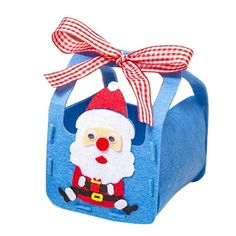 a blue bag with a santa clause on the front and a red bow hanging from it