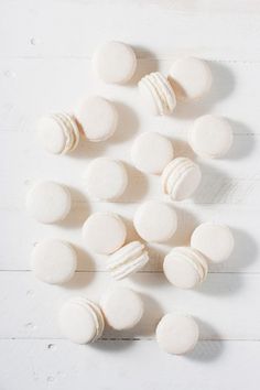 several white macaroni and cheeses on a white wooden table top view from above