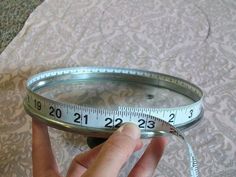 a person holding a measuring tape in their hand