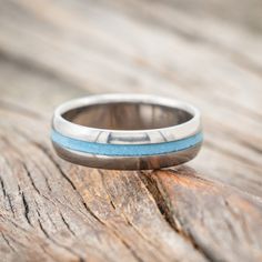 a close up of a ring on a wooden surface