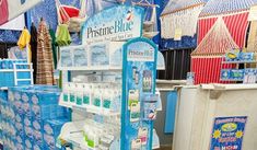 a store display with blue and white items on it's shelves in a store